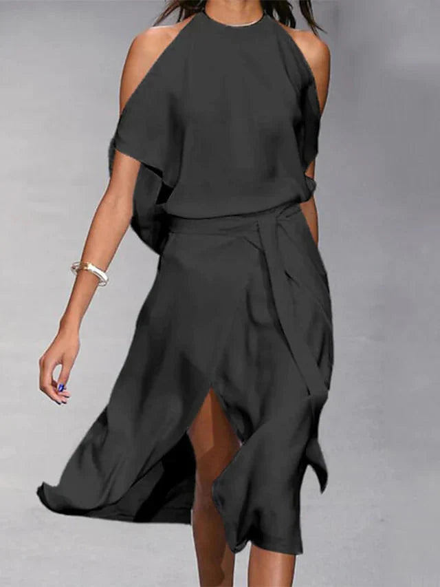 Madonna - Elegantes Kleid mit modischen Schulterausschnitten.